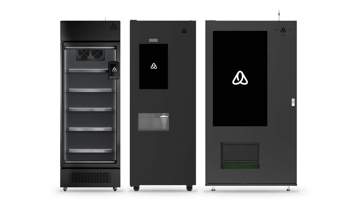 Three Alnos Vending machines side by side: an AI smart cooler with a glass door, a coffee machine with a 22″ screen and a snack & drink machine with a 49″ touchscreen. Illustrative render.